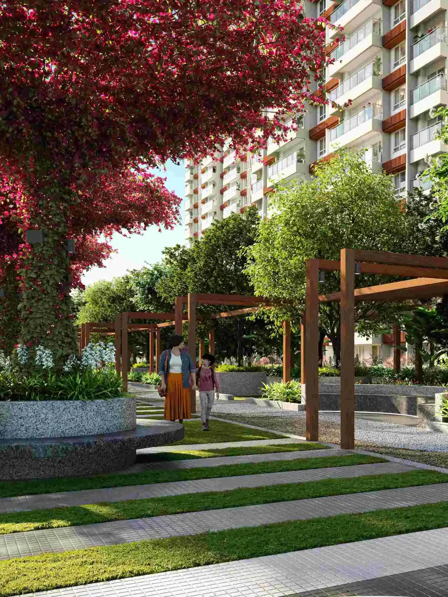 A garden walk under pink bougainvillea canopies beside the towers